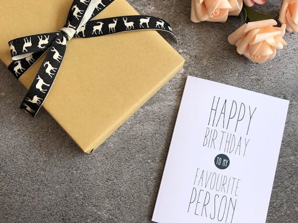 Birthday card with gift and flowers